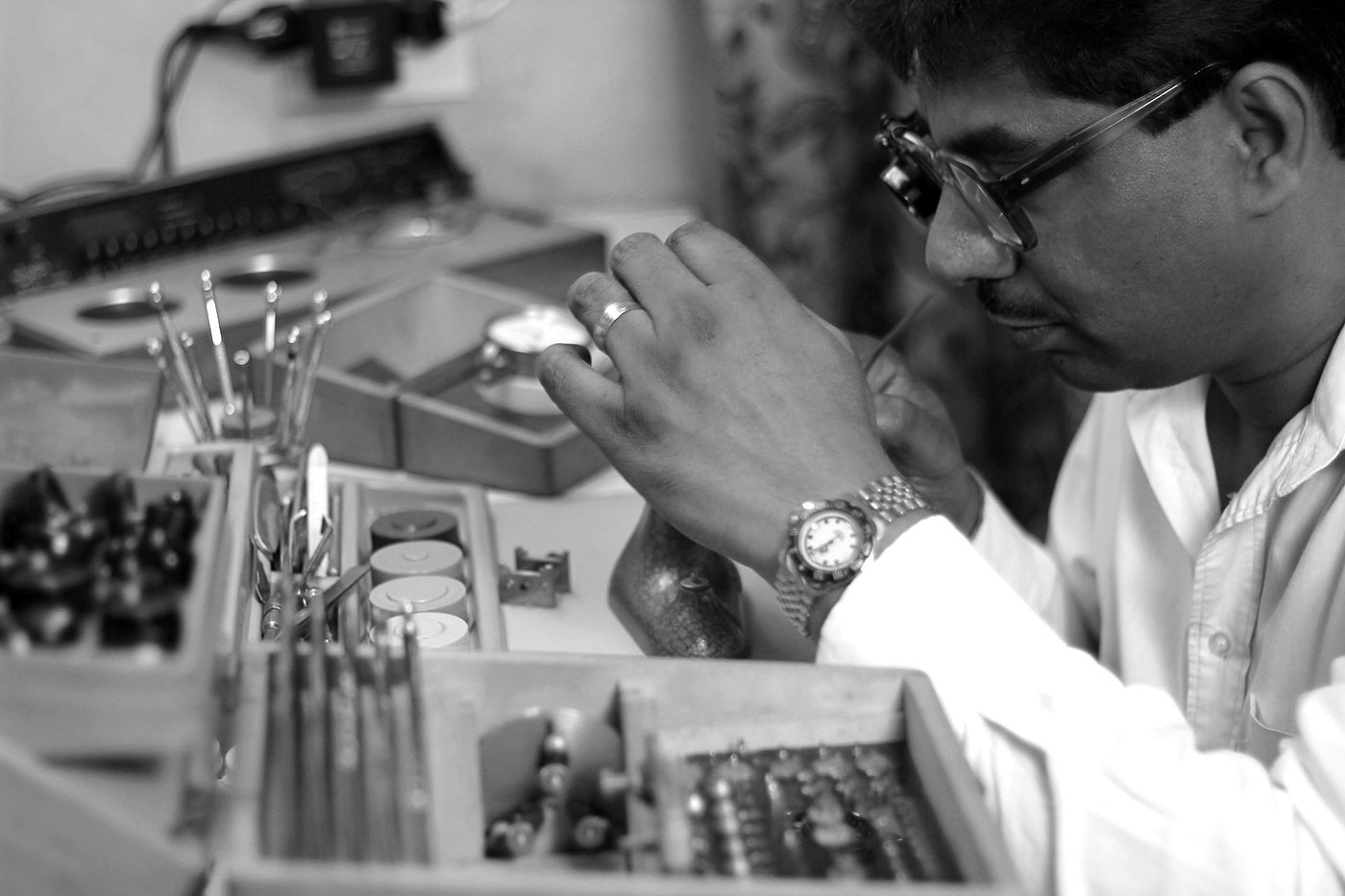 Devan Moodley working on watch