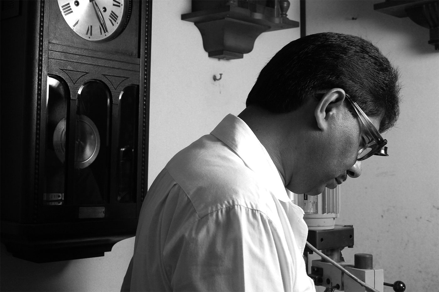 Deval Moodley with wall clocks