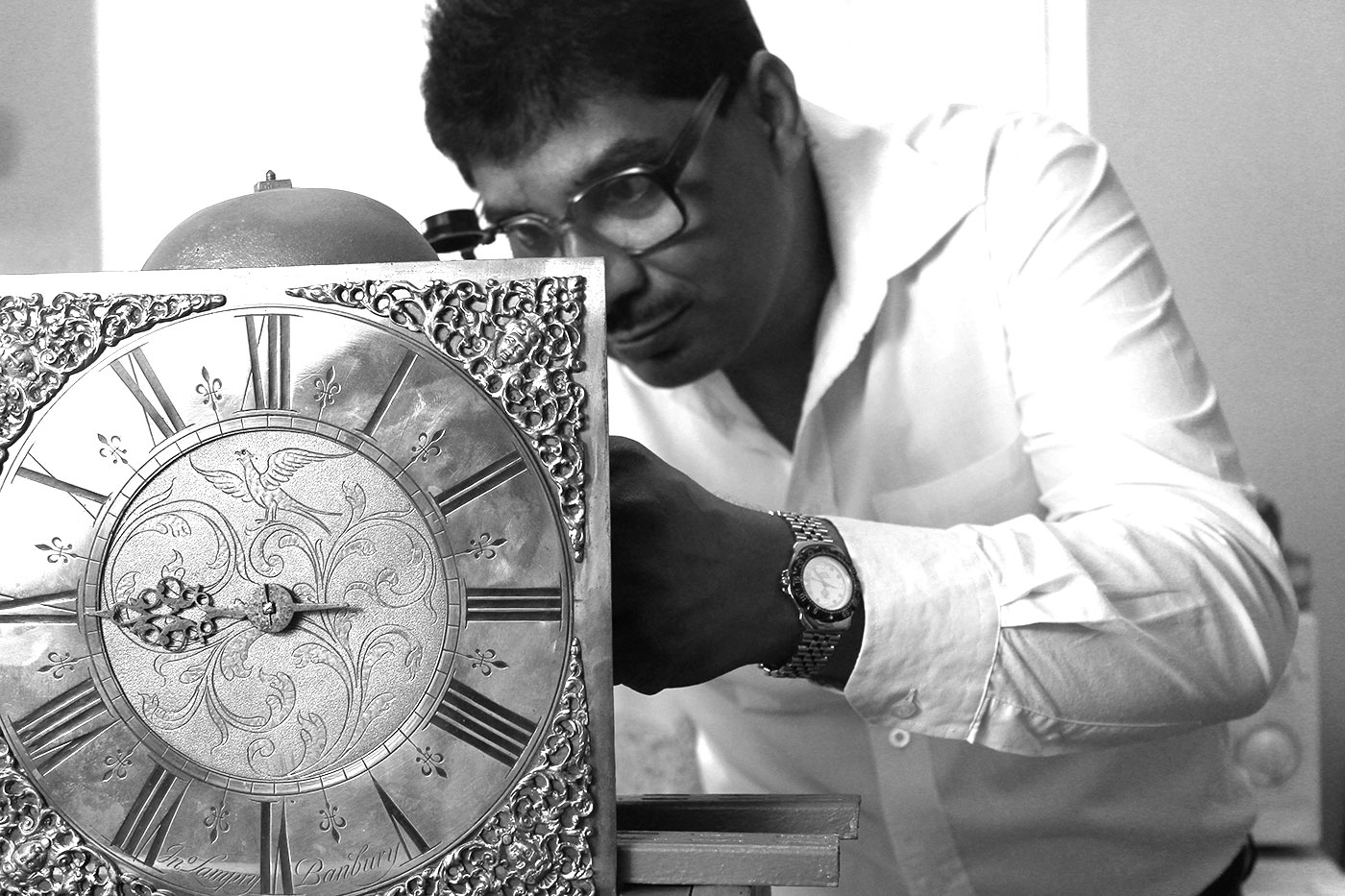 Devan Moodley working on clock